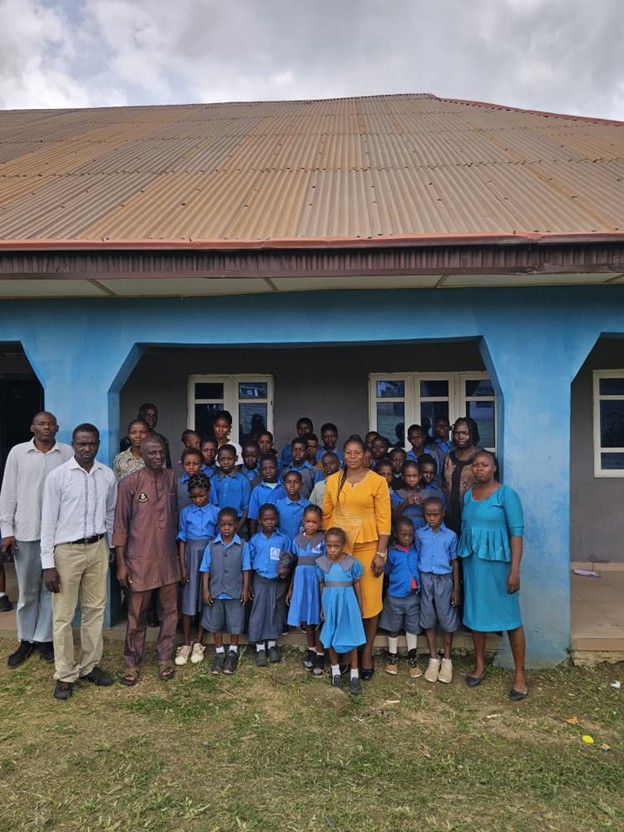 Senior research scientist advising young laboratory technicians